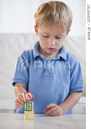 Child playing with ABC blocks 10349797