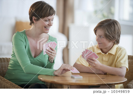 Mother and son playing cards 10349859