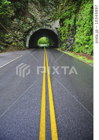 A scenic and empty road with tunnel 10349897