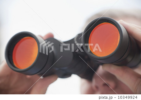 Man using binoculars Man using binoculars 10349924