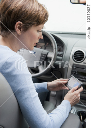 Woman in car with GPS Woman in car with GPS 10350027