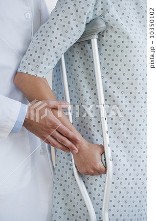 Doctor and patient with crutches Doctor and patient with crutches 10350102