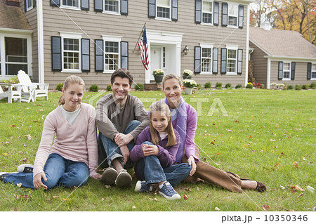 Family in front of house 10350346