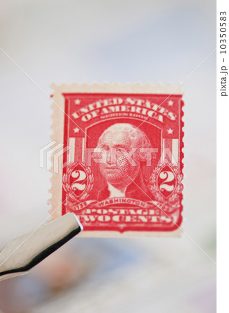 Tweezers holding stamp 10350583