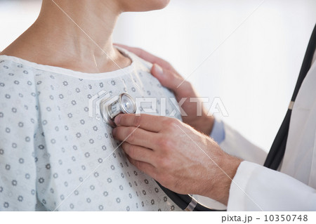Doctor checking patient with stethoscope 10350748