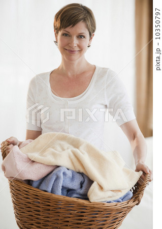 Woman doing laundry Woman doing laundry 10350797