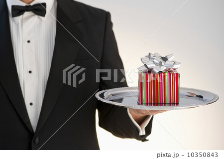 Butler holding gift Butler holding gift 10350843