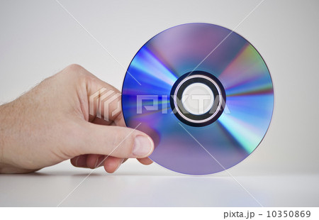 Hand holding compact disc 10350869