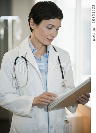 Doctor looking at chart Doctor looking at chart 10351222
