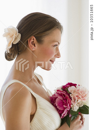 Bride holding bouquet of flowers Bride holding bouquet of flowers 10351665