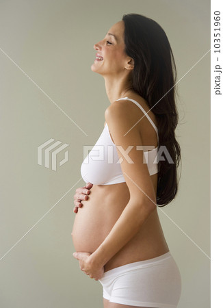 Pregnant woman holding her belly Pregnant woman holding her belly 10351960