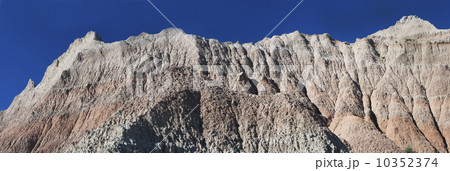 USA, South Dakota, Mountain against blue sky in Badlands National Park USA, South Dakota, Mountain against blue sky in Badlands National Park 10352374