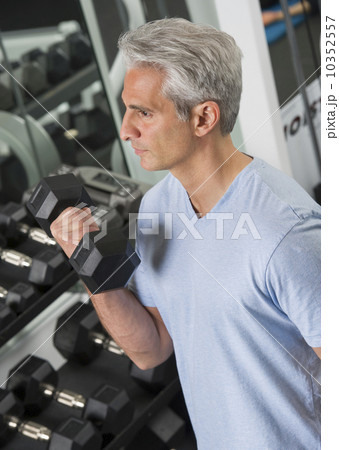 Man lifting free weights at the gym 10352557