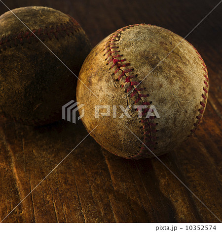 Antique baseballs on wooden floor 10352574