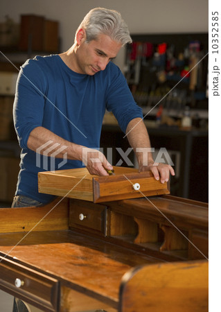 Craftsman fixing a piece of furniture 10352585