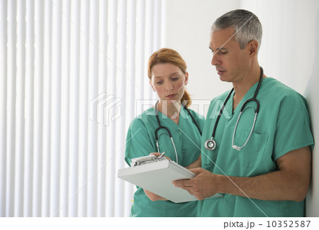 Healthcare professionals looking at medical chart Healthcare professionals looking at medical chart 10352587