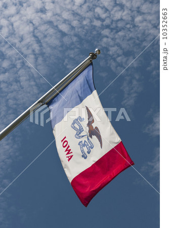 USA, Iowa State flag against sky 10352663