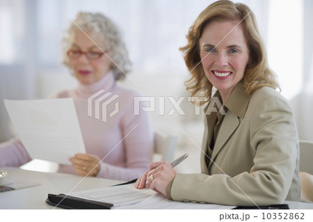 USA, New Jersey, Jersey City, Portrait of financial advisor with senior woman in home 10352862
