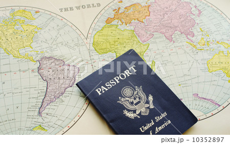 Close-up of passport lying on map 10352897