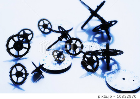 Close up of gears and clock parts on white background 10352970