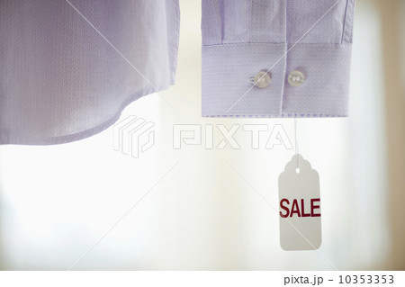 Close up of shirt cuff with sale tag Close up of shirt cuff with sale tag 10353353