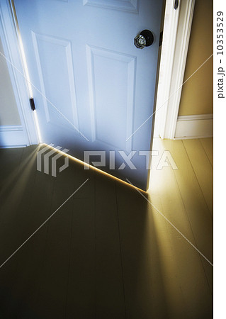 Sunlight shining through open door Sunlight shining through open door 10353529