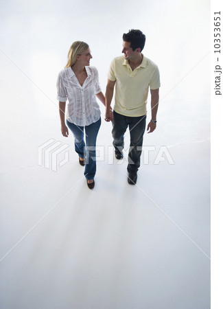 Happy couple walking hand in hand Happy couple walking hand in hand 10353651