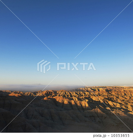 USA, South Dakota, Mountains in morning fog in Badlands National Park 10353655