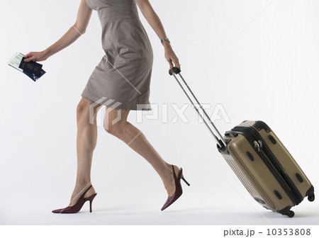 Young woman with suitcase, studio shot Young woman with suitcase, studio shot 10353808