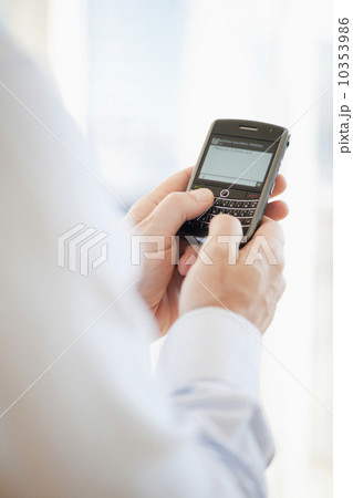 USA, New Jersey, Jersey City, Man holding mobile phone USA, New Jersey, Jersey City, Man holding mobile phone 10353986
