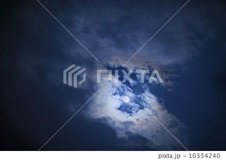 Full moon in cloudy sky at night 10354240