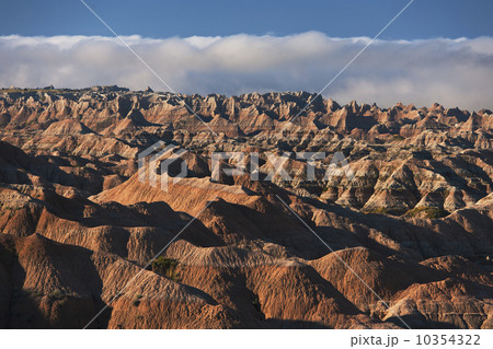 USA, South Dakota, Mountains in morning fog in Badlands National Park USA, South Dakota, Mountains in morning fog in Badlands National Park 10354322