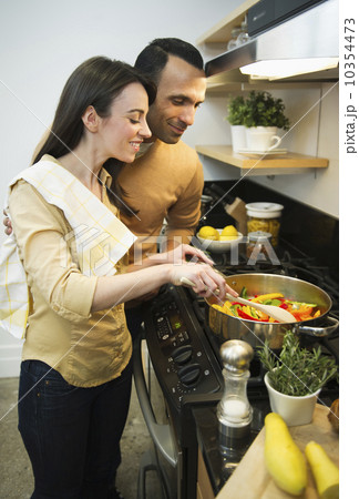 Couple cooking meal in kitchen 10354473