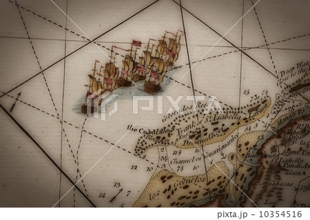 Close up of antique map of coastline of England with tall ships Close up of antique map of coastline of England with tall ships 10354516