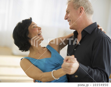 Happy mature couple dancing Happy mature couple dancing 10354950