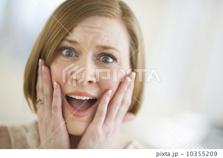 USA, New Jersey, Jersey City, portrait of shocked woman 10355209