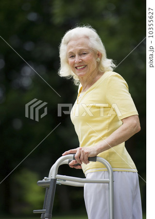 Senior woman walking with walker 10355627