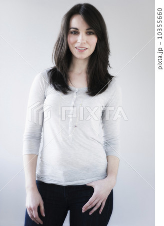 Studio portrait of young woman smiling 10355660