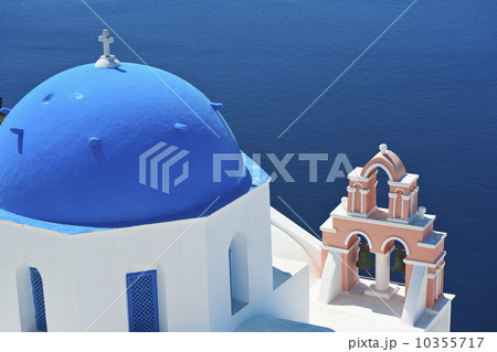 Greece, Cyclades Islands, Santorini, Oia, Church with bell tower by sea 10355717
