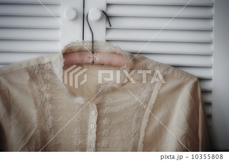 Blouse hanging on wardrobe door 10355808