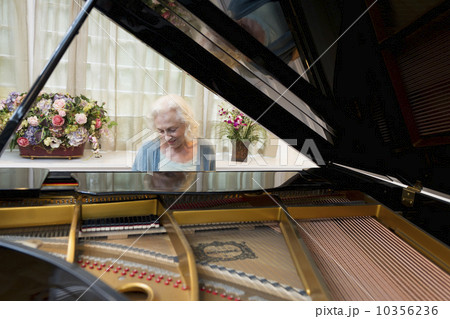 Senior woman playing piano 10356236