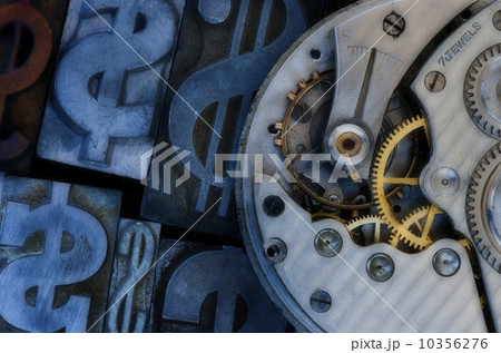 Close up of clock mechanism and dollar sign 10356276