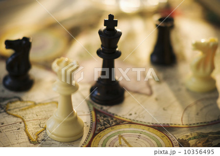 Chess pieces on old world map 10356495