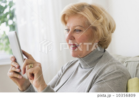 Senior woman using digital tablet 10356809