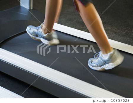 Low section of woman walking on treadmill 10357023