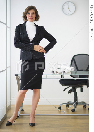 USA, New Jersey, Jersey City, businesswoman posing in office USA, New Jersey, Jersey City, businesswoman posing in office 10357245