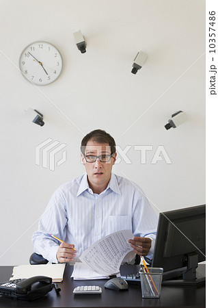 Businessman under surveillance of security cameras 10357486