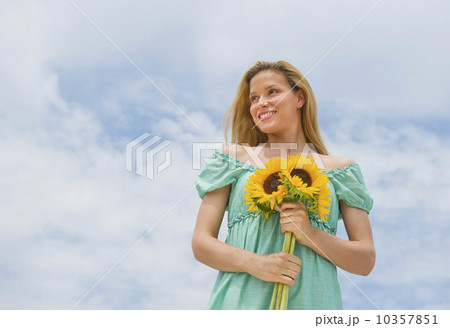 Woman holding sunflowers 10357851
