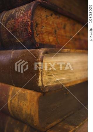 Close up of antique books in leather covers, studio shot Close up of antique books in leather covers, studio shot 10358029