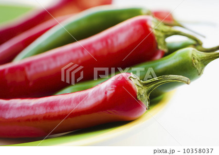 Studio shot of red and green Chili Peppers Studio shot of red and green Chili Peppers 10358037